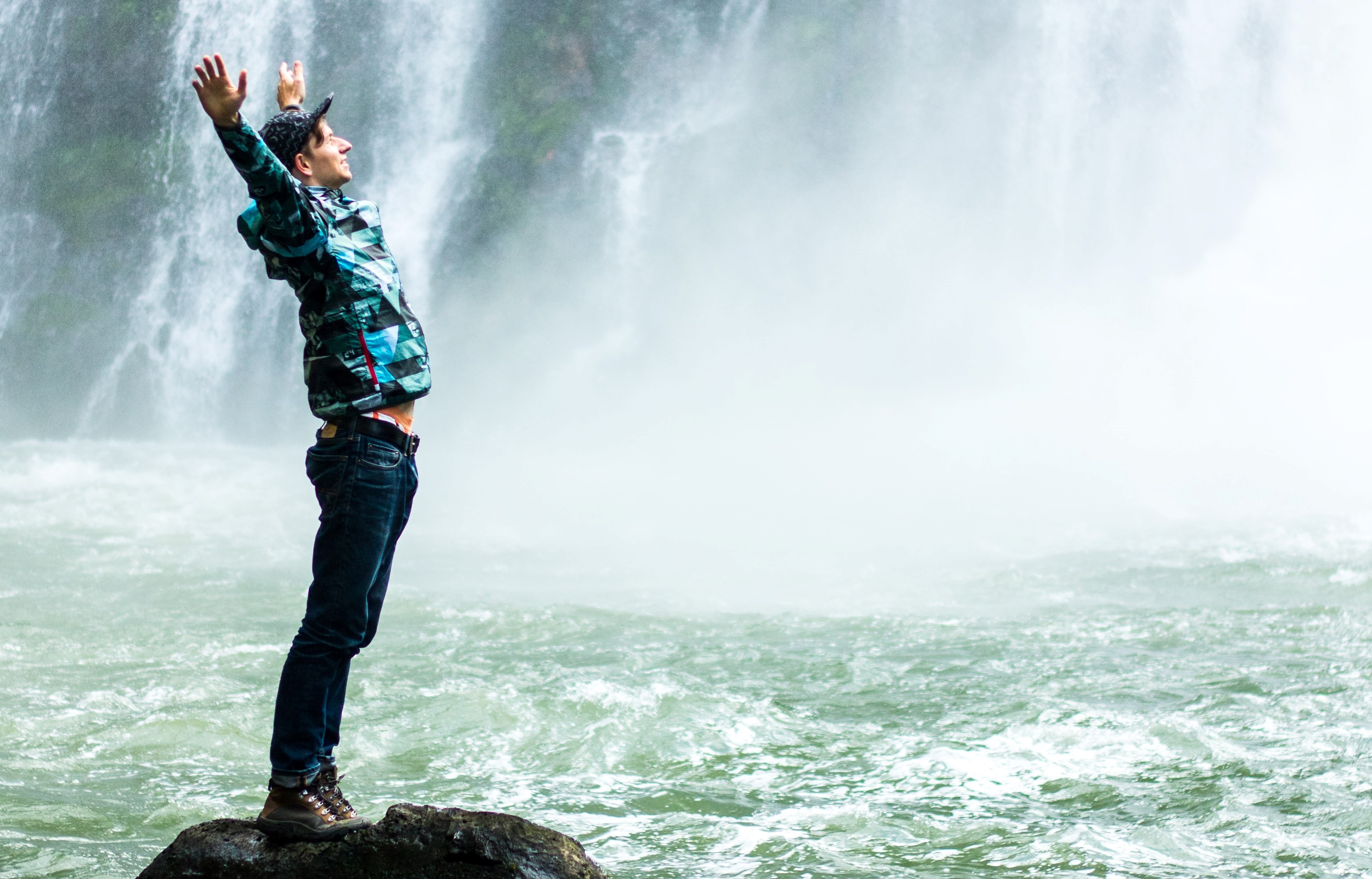 Man by waterfall